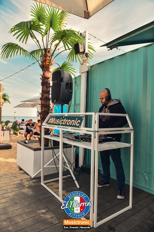 Trevor Pinto of Musictronic on the decks at El Murrino Beachside Kitchen & Bar, Bournemouth Beach UK